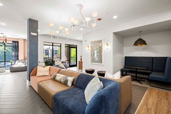Resident co-working lounge with coffee bar and business center with pcs and wireless printing